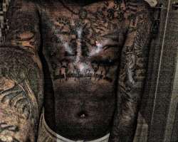 He has several tattoos on his upper body He has several tattoos on his upper body.